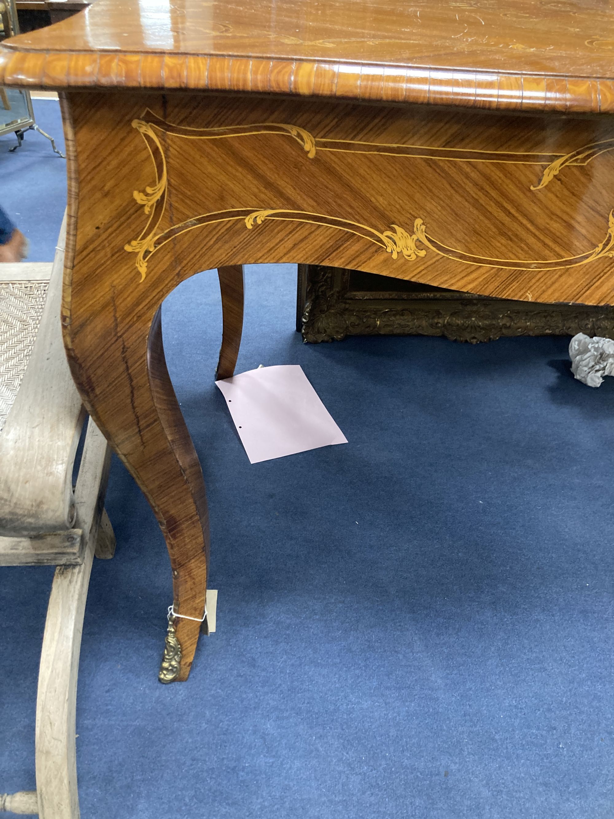 A Louis XVI design marquetry inlaid kingwood serpentine centre table, width 196cm depth 90cm height 79cm